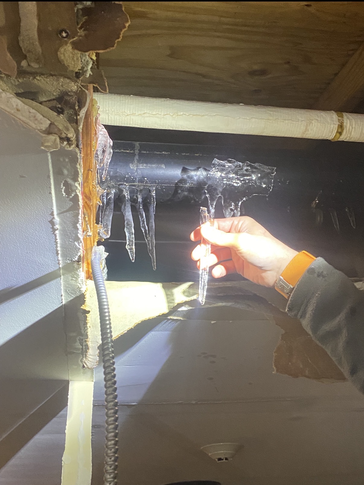 Plumber repairs frozen pipes.